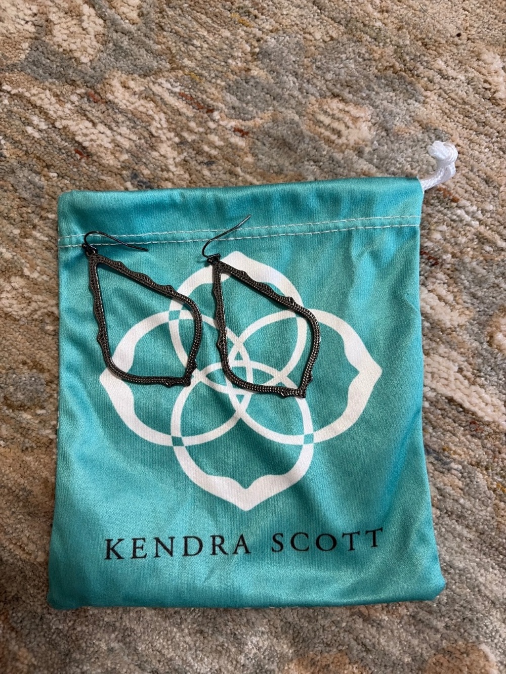 Kendra Scott earrings.